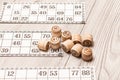 Board game lotto on white desk. Wooden lotto barrels and game ca Royalty Free Stock Photo