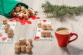 Wooden lotto barrels with bag, game cards, red chips, cup of coffee and Christmas fir tree branches Royalty Free Stock Photo