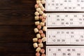 Board game lotto with wooden barrels. Lotto cards. Bingo games. Gambling Royalty Free Stock Photo