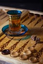 Board games in backgammon, tawla, shesh-besh, kosh. Glass cup for Armudu tea Royalty Free Stock Photo