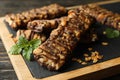 Board with granola bars on background, close up