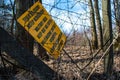 A board informing about an military area abandoned. `Teren wojskowy wstÃâ¢p wzbroniony` means military area keep out no entry