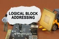 On the board with microcircuits lies a paper plate with the inscription - Logical Block Addressing