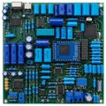 Board (PCB) with numerous electronic components including capacitors, Royalty Free Stock Photo