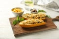 Board with quinoa stuffed zucchini boats on white wooden table Royalty Free Stock Photo