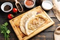 Board with Qutabs and sause on dark rustic wooden table