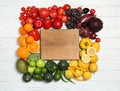 Board in rainbow frame of fruits and vegetables Royalty Free Stock Photo