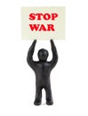 Board stop war.A man with a poster stop war. Peaceful protesters. Figurine with a poster