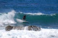 Board surfer riding in a wave at Laguna Beach, CA.