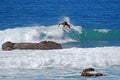 Board surfer riding in a wave at Laguna Beach, CA.