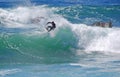 Board surfer riding in a wave at Laguna Beach, CA.