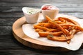Board with sweet potato fries and sauces Royalty Free Stock Photo