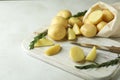 Board with tasty young potato, close up