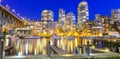 Board walk and marina docking along False Creek at blue hour in Vancouver BC, Canada Royalty Free Stock Photo