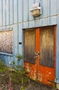 Boarded and locked doors at closed mine building