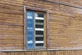 Boarded up window on weathered wooden wall Royalty Free Stock Photo