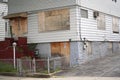 Boarded up door and windows of New York City suburb residential home