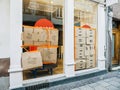 Boarded Up Storefront with Cardboard Boxes Inside