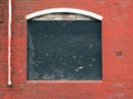 Boarded up window in a derelict abandoned house Royalty Free Stock Photo