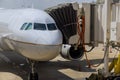 Boarding bridge jetway connected to the airplane for boarding passengers