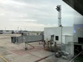 Boarding Bridge on the tarmac of an airport. Jet aircraft docked at the gate. Royalty Free Stock Photo