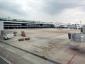 Boarding Bridge on the tarmac of an airport. Jet aircraft docked at the gate. Royalty Free Stock Photo