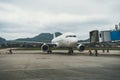 Boarding plane terminal. Airplane at the gate in airport. An airplane is stopped on the track at gate for boarding. Corridor Royalty Free Stock Photo