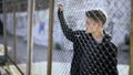 Boarding school restrictions, teen boy behind fence confinement, broken future