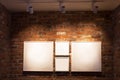 Boards in frames on brick wall Royalty Free Stock Photo