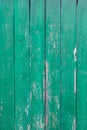 Boards of an old wooden fence covered with green paint. Royalty Free Stock Photo