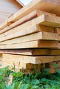 Boards in stack against wooden house Royalty Free Stock Photo