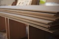 Boards are stacked. Plywood sheet. Joinery. They made furniture production. Building material in garage. Raw wood Royalty Free Stock Photo