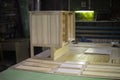 Boards in workshop. Furniture details. Polished wood. Materials on table