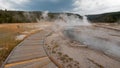 Boardwalk curving around Hot Cascades hot spring in the Lower Geyser Basin in Yellowstone National Park in Wyoming