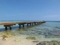 A boardwalk extends from the beach out to the Atlantic Ocean in beautiful Key West Florida.