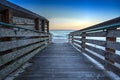 Boardwalk leading down to the white sand of Vanderbilt Beach at sunrise Royalty Free Stock Photo