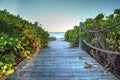 Boardwalk leading down to the white sand of Vanderbilt Beach at sunrise Royalty Free Stock Photo