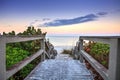 Boardwalk leading down to the white sands along the North Gulf Shore Beach at sunrise Royalty Free Stock Photo