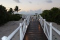 Boardwalk leading to the beach as the sun falls. Royalty Free Stock Photo