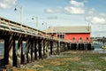 A wood boardwalk out to a marine supply business.. Royalty Free Stock Photo