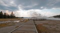 Boardwalk next to Tangled Creek and Black Warrior Springs leading into Hot Lake in Yellowstone National park in Wyoming USA