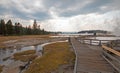 Boardwalk next to Tangled Creek and Black Warrior Springs leading into Hot Lake in Yellowstone National park in Wyoming USA Royalty Free Stock Photo