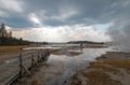 Boardwalk next to Tangled Creek and Black Warrior Springs leading into Hot Lake in Yellowstone National park in Wyoming USA