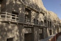 Boardwalk with numbered caves at Mogao Grottoes, Dunhuang, Ganzu, China