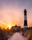 Vibrant colorful sunset as clouds streak across the sky. Fire Island Lighthouse, New York Royalty Free Stock Photo