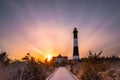 Vibrant colorful sunset as clouds streak across the sky. Fire Island Lighthouse, New York Royalty Free Stock Photo