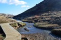 Boardwalk Running Along the Side of a Winding River Royalty Free Stock Photo