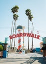 Boardwalk sign with palm trees, in Santa Cruz, California