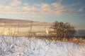Boardwalk to the beach through dunes covered by fresh snow in winter morning Royalty Free Stock Photo