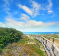 Boardwalk under a cloudy sky in Capo Testa Royalty Free Stock Photo